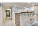 White kitchen with granite countertops and stainless steel appliances at 2711 S Ocean Blvd. S # 1421, North Myrtle Beach, SC 29582