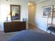 Spacious bedroom with dresser, mirror, and additional shelving at 302 71St Ave. N # 503, Myrtle Beach, SC 29572