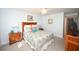 Bedroom with two nightstands and floral bedding at 5600 N Ocean Blvd. # C2, North Myrtle Beach, SC 29582