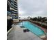Resort-style pool with plenty of lounge chairs at 7100 N Ocean Blvd. # 219, Myrtle Beach, SC 29572