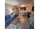 Open living room with comfortable seating and light wood floors at 7100 N Ocean Blvd. # 219, Myrtle Beach, SC 29572