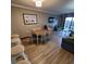 Bright dining area with table and chairs, adjacent to living room at 7100 N Ocean Blvd. # 219, Myrtle Beach, SC 29572