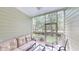 Relaxing screened porch with outdoor seating and views of the backyard at 35 Delray Dr. # 1-D, Murrells Inlet, SC 29576