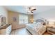 Spacious bedroom with a large bed, dresser, and plenty of natural light at 35 Delray Dr. # 1-D, Murrells Inlet, SC 29576