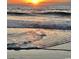 Stunning sunrise over the ocean waves at 35 Delray Dr. # 1-D, Murrells Inlet, SC 29576