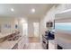 Open concept kitchen with granite countertops and stainless steel appliances at 35 Delray Dr. # 1-D, Murrells Inlet, SC 29576