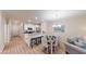Open concept dining area with seating for four and kitchen access at 35 Delray Dr. # 1-D, Murrells Inlet, SC 29576