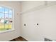 Bright laundry room with built-in shelving and window at 115 Six Mile Creek Dr., Georgetown, SC 29440