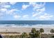 Stunning ocean view from a high-rise balcony with beach and palm trees at 2710 N Ocean Blvd. # 538, Myrtle Beach, SC 29577