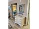 View down the hallway towards the bedroom with decorative elements on a white dresser at 9621 Shore Dr. # J-229, Myrtle Beach, SC 29572