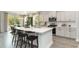 Modern kitchen boasts white cabinets, quartz countertops, and stainless steel appliances at 133 Fair Meadow Ct., Loris, SC 29569
