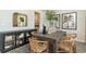 Elegant dining room with a rustic table and wicker chairs at 133 Fair Meadow Ct., Loris, SC 29569