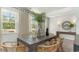 Bright dining room features a rustic table with wicker chairs, offering a casual yet elegant space at 133 Fair Meadow Ct., Loris, SC 29569