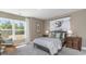 Bedroom with large window, comfortable bed, and wooden nightstand at 133 Fair Meadow Ct., Loris, SC 29569