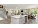 Open kitchen with island, stainless steel appliances, and view to Gathering room at 133 Fair Meadow Ct., Loris, SC 29569