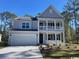 Two-story house with gray siding, white columns, and a two-car garage at 133 Fair Meadow Ct., Loris, SC 29569
