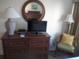 Bedroom with dresser, TV, and comfortable seating at 14290 Ocean Hwy. # 103, Pawleys Island, SC 29585