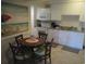 Small dining area with round table and four chairs at 14290 Ocean Hwy. # 103, Pawleys Island, SC 29585