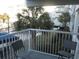 Balcony with patio furniture and partial pool view at 14290 Ocean Hwy. # 103, Pawleys Island, SC 29585