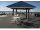 Scenic beach gazebo with tables and chairs for outdoor dining at 14290 Ocean Hwy. # 103, Pawleys Island, SC 29585