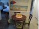 Small dining area with round table and four chairs at 14290 Ocean Hwy. # 103, Pawleys Island, SC 29585