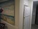 Kitchen with refrigerator and beach-themed art at 14290 Ocean Hwy. # 103, Pawleys Island, SC 29585
