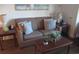 Living room with sofa, coffee table, and end tables at 14290 Ocean Hwy. # 103, Pawleys Island, SC 29585