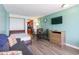Open living space with a sofa bed, dining table, and kitchen peek at 1501 S Ocean Blvd. # 936, Myrtle Beach, SC 29577