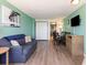 Bright living area with sofa, dining table and view into kitchen at 1501 S Ocean Blvd. # 936, Myrtle Beach, SC 29577
