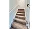 Carpeted staircase with simple railing at 1424 Nathan Dr., Loris, SC 29569