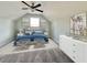 Charming bedroom with a blue bedspread and white dresser at 1424 Nathan Dr., Loris, SC 29569