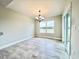 Bright dining area with chandelier and sliding glass doors leading to backyard at 1424 Nathan Dr., Loris, SC 29569