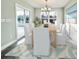 Dining room with light wood table, six chairs, and sliding glass doors at 1424 Nathan Dr., Loris, SC 29569