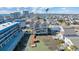 Aerial view of a three-story home situated by the water with a dock and neighboring buildings at 206 60Th Ave. N # 203, North Myrtle Beach, SC 29582