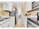 Clean and functional kitchen with stainless steel appliances and white cabinets at 206 60Th Ave. N # 203, North Myrtle Beach, SC 29582