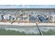 Aerial view of a beachside community with a pier and several buildings at 206 60Th Ave. N # 203, North Myrtle Beach, SC 29582