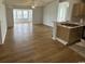 Open concept living room with new flooring and access to kitchen at 2273 Huntingdon Dr. # J, Surfside Beach, SC 29575