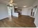 Spacious living room with wood-look floors and kitchen access at 2273 Huntingdon Dr. # J, Surfside Beach, SC 29575