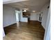 Open living room with wood-look floors and kitchen views at 2273 Huntingdon Dr. # J, Surfside Beach, SC 29575