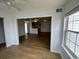 Open living area with wood-look floors and access to kitchen at 2273 Huntingdon Dr. # J, Surfside Beach, SC 29575