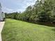 Landscaped backyard with pond and trees at 2273 Huntingdon Dr. # J, Surfside Beach, SC 29575