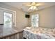 Bedroom with a queen-size bed and private access to deck at 6001 South Kings Hwy., Myrtle Beach, SC 29575