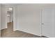 Neutral-toned office with wood-look floors and an interior door at 120 Little Cedar Dr., Loris, SC 29569