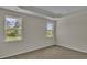Bright bedroom with two windows and neutral walls at 120 Little Cedar Dr., Loris, SC 29569