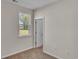 Bedroom with window and door to bathroom at 120 Little Cedar Dr., Loris, SC 29569