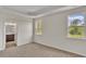 Spacious bedroom with two windows and ensuite bathroom at 120 Little Cedar Dr., Loris, SC 29569