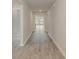 Long hallway with wood-look flooring leading to other rooms at 4246 Milkweed Rd., Shallotte, NC 28470