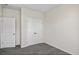 Bedroom with gray carpet and double door closet at 3047 Deerberry Place, Longs, SC 29568