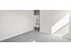 Bedroom with grey carpet and access to another room at 3047 Deerberry Place, Longs, SC 29568