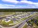 Aerial view of houses near a lake at 3047 Deerberry Place, Longs, SC 29568